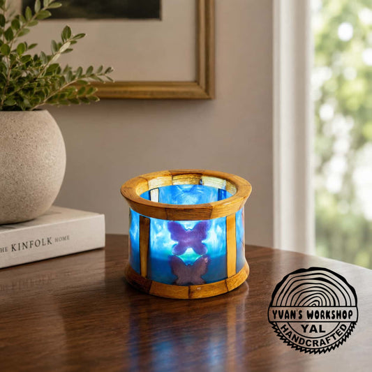 Turned apple wood and blue epoxy candle holder with butterfly design