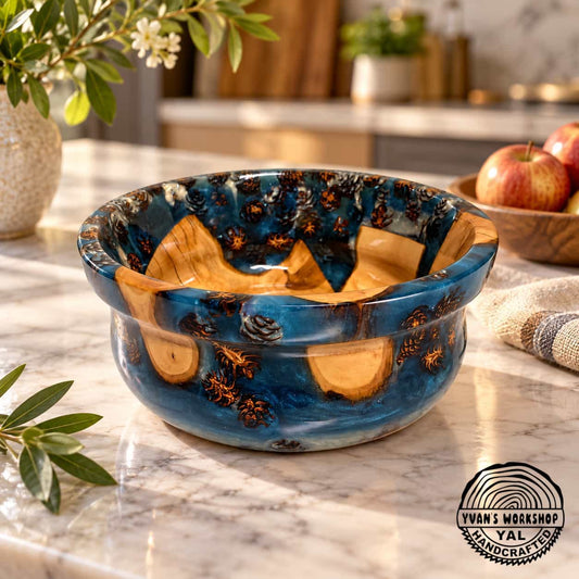 Blue Sapphire Apple Wood & Epoxy Bowl displayed on a kitchen counter, handcrafted in Canada with blue resin and visible natural cone inclusions.