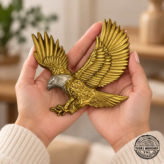  Gold flying eagle ornament with silver head resting in both hands