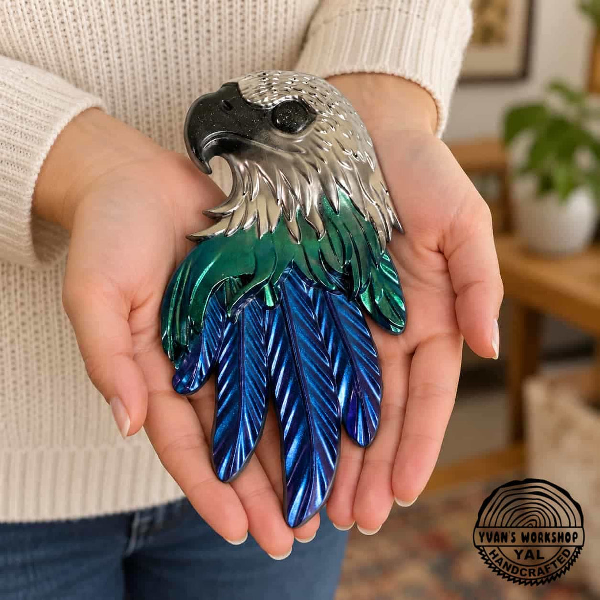 Chrome eagle head ornament with green middle feathers and metallic blue lower feathers