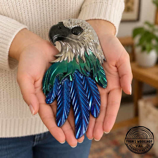 Chrome eagle head ornament with green middle feathers and metallic blue lower feathers