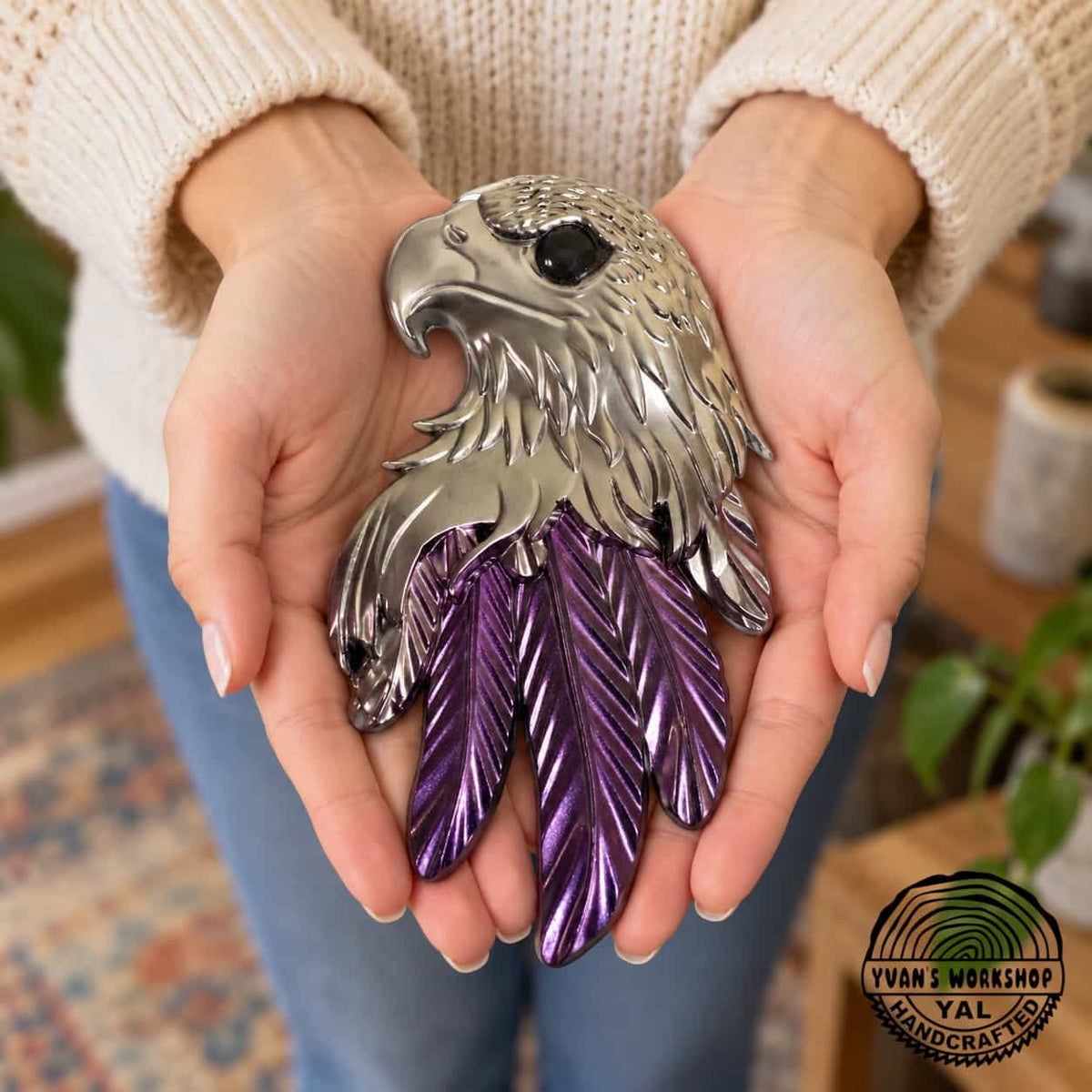 Silver eagle head ornament with bright metallic purple lower feathers