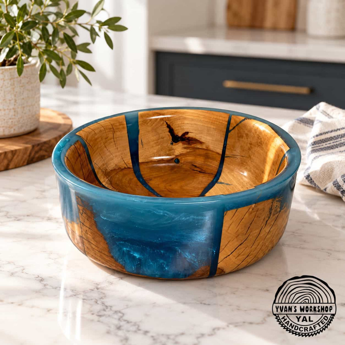 Natural apple wood bowl with blue epoxy sections and smooth turned rim