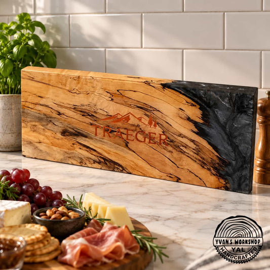 Long spalted maple board with charcoal epoxy panel and mountain motif engraving